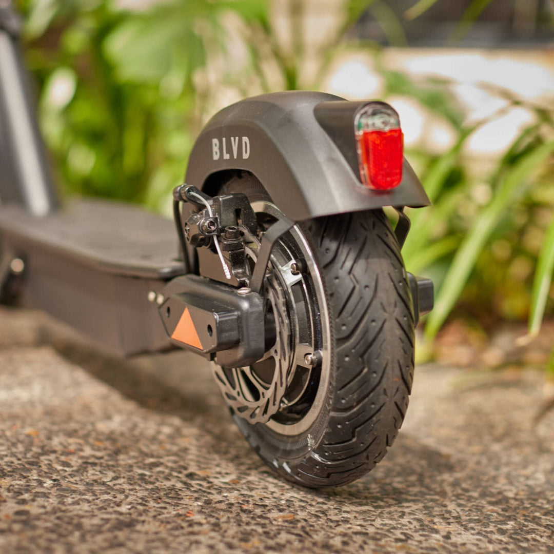 close up view of blvd elite electric scooter rear wheel and motor hub
